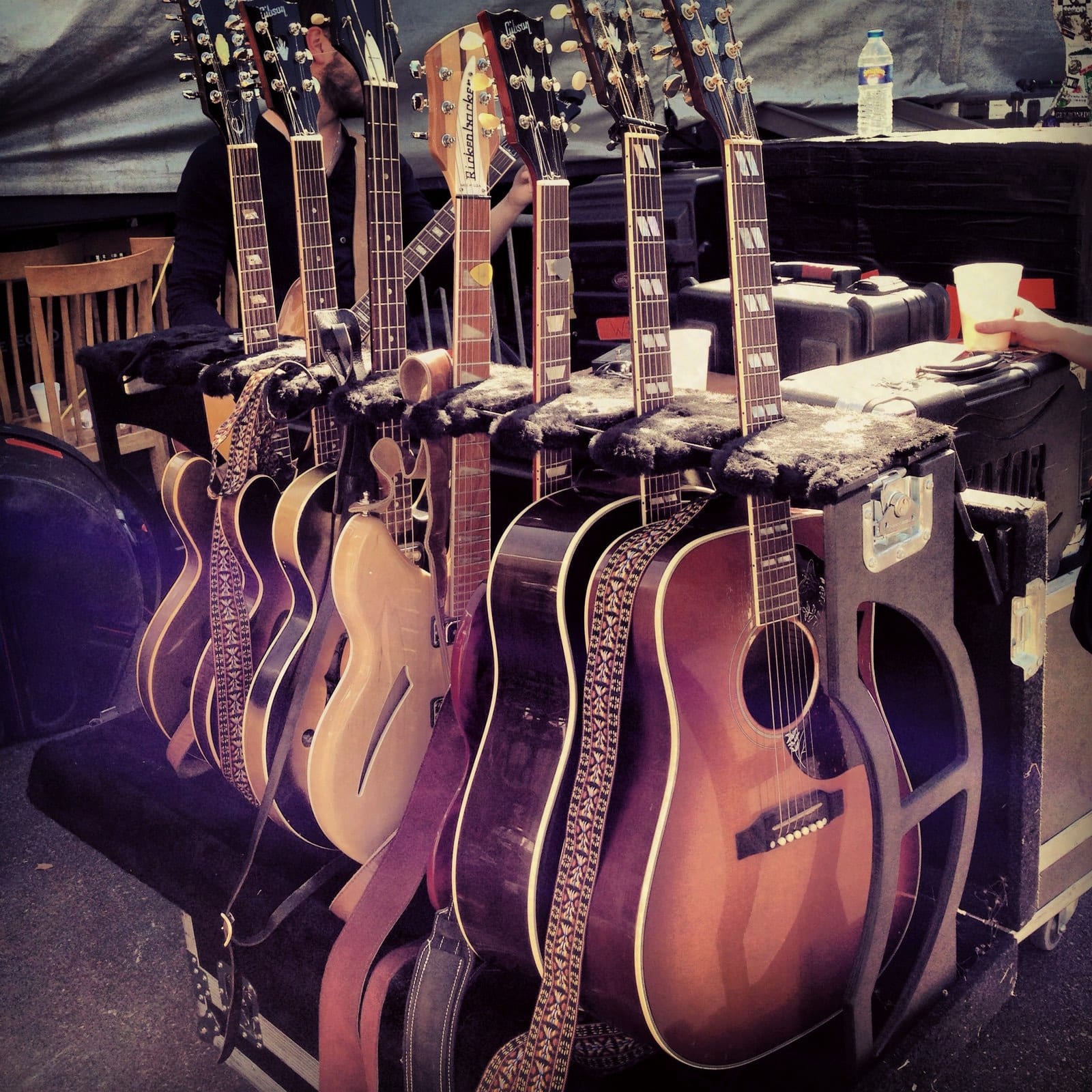 A row of acoustic and electric guitars prepared backstage at the Double Decker festival in Oxford.