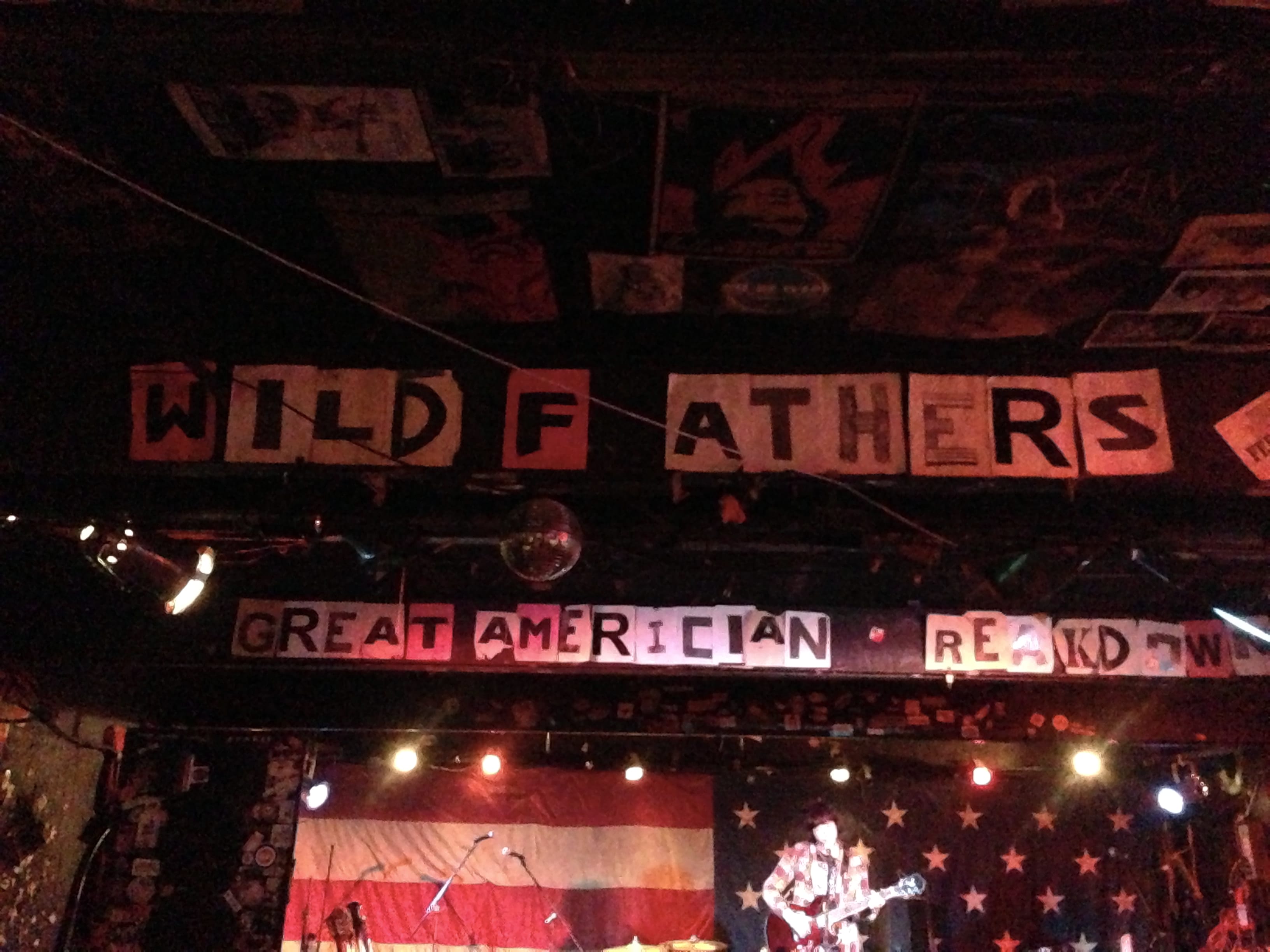A venue banner outside The Nick naming The Wild Feathers and Great American Taxi.