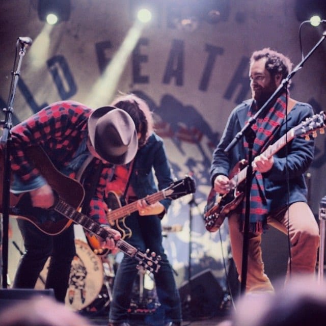 The Wild Feathers performing under stage lights at Soul Kitchen in Mobile.