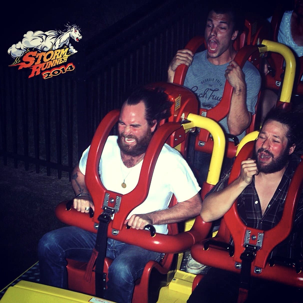 Three unidentified Wild Feathers members reacting aboard the Storm Runner roller coaster at Hersheypark in 2014.