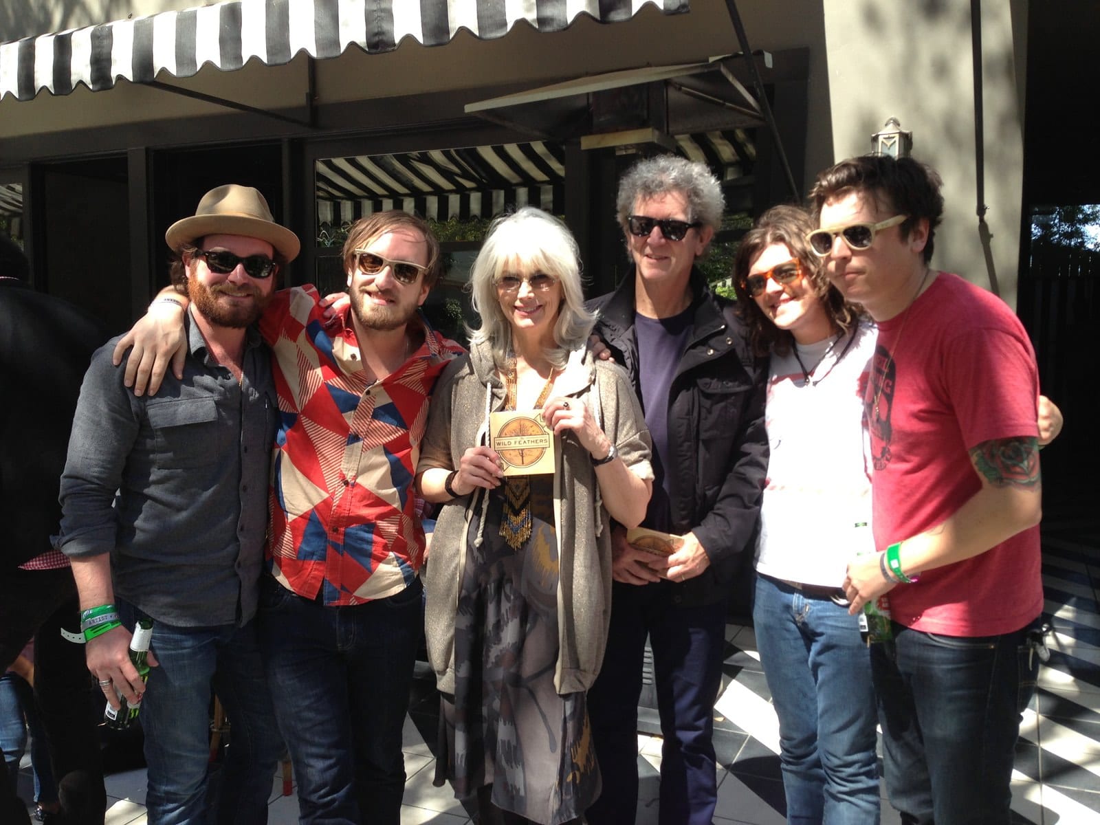 Members of The Wild Feathers and guests gathered outdoors during the St. David's Church SXSW stop in Austin.