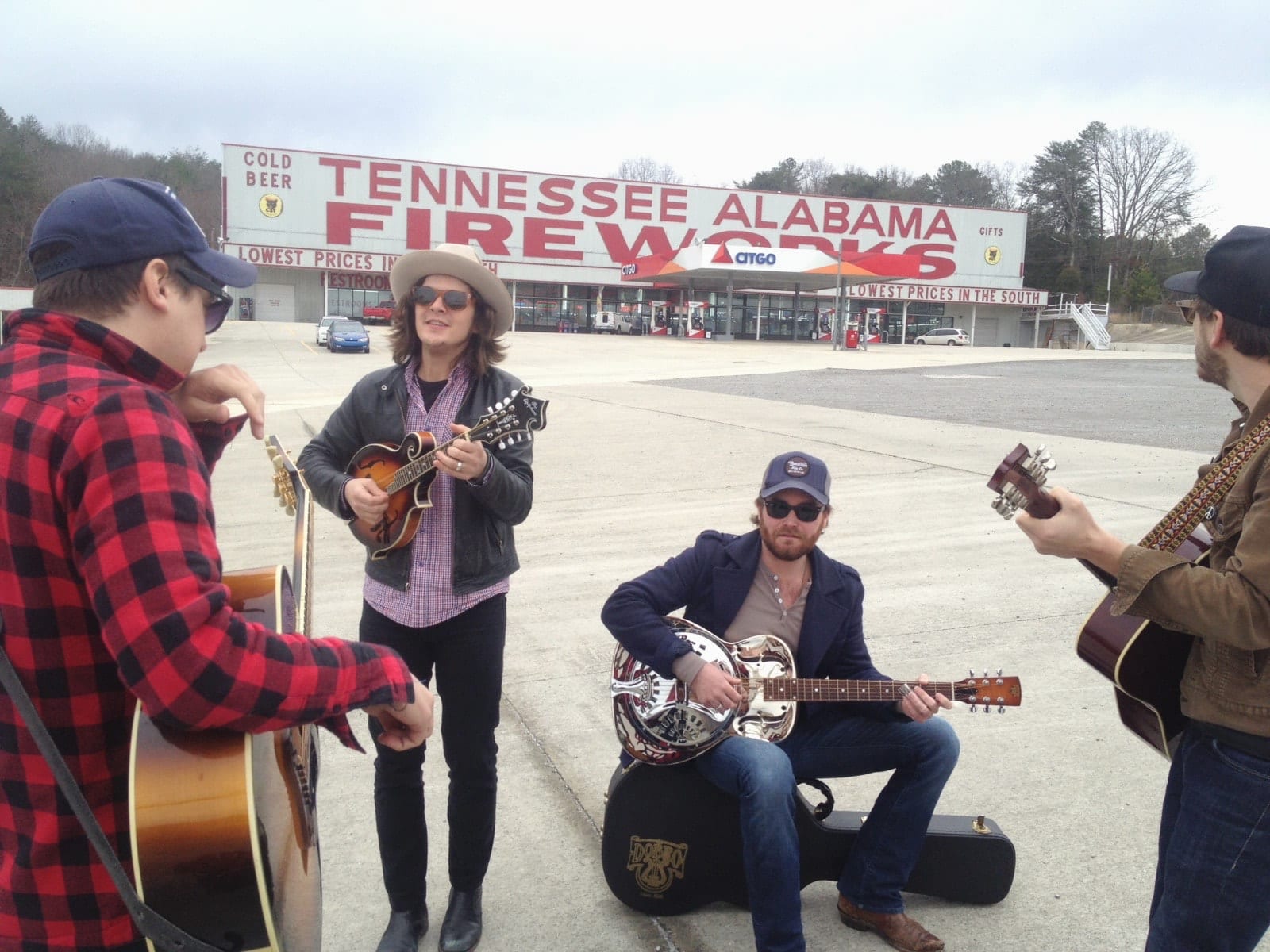 Members of The Wild Feathers playing outside the Tennessee Alabama Fireworks store near South Pittsburg.