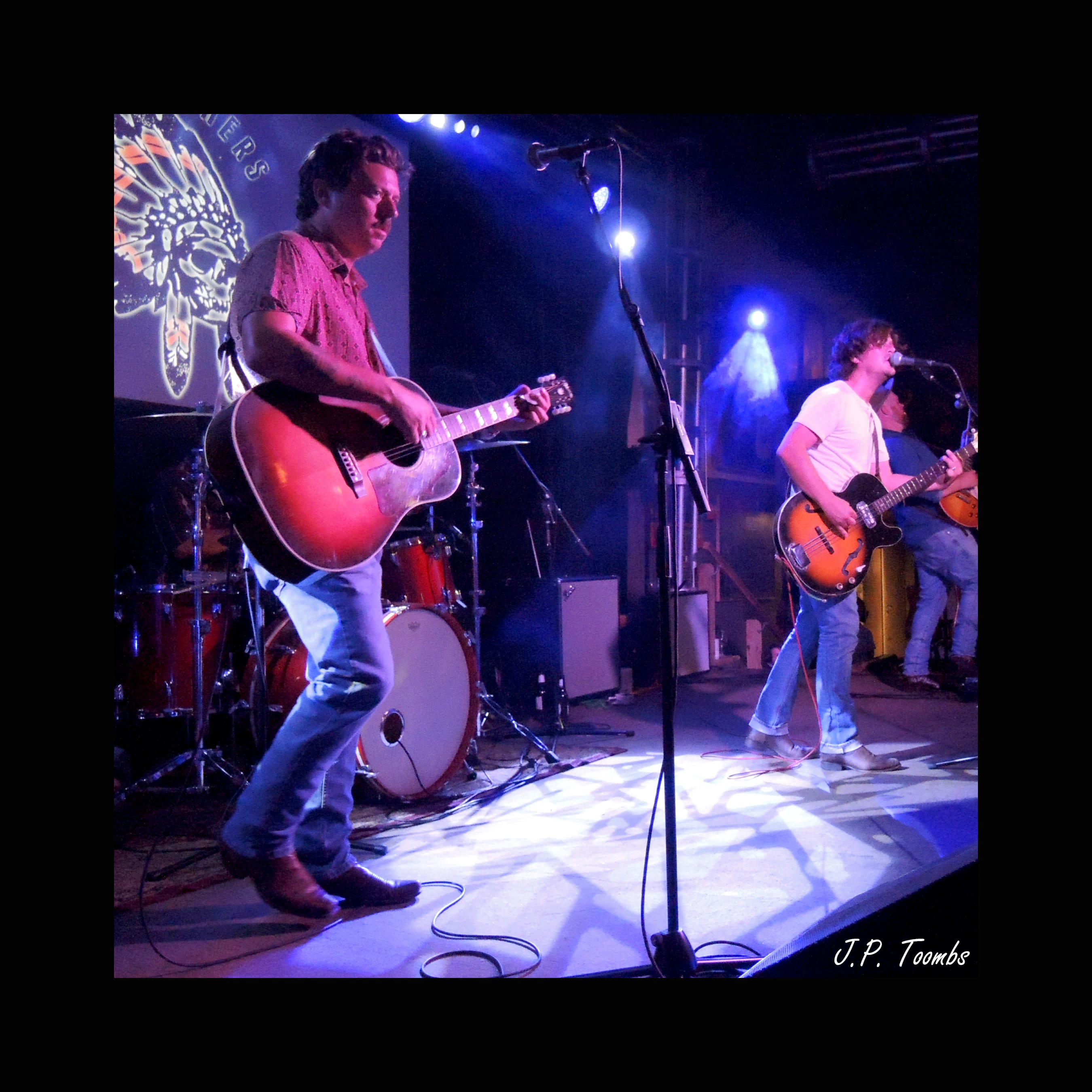 Members of The Wild Feathers lean into the performance across the lit 3rd & Lindsley stage in Nashville.