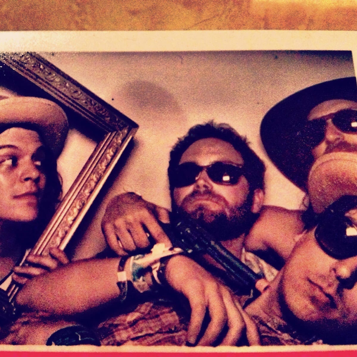 Members of The Wild Feathers gathered together in a square offstage photograph in Eugene, Oregon.