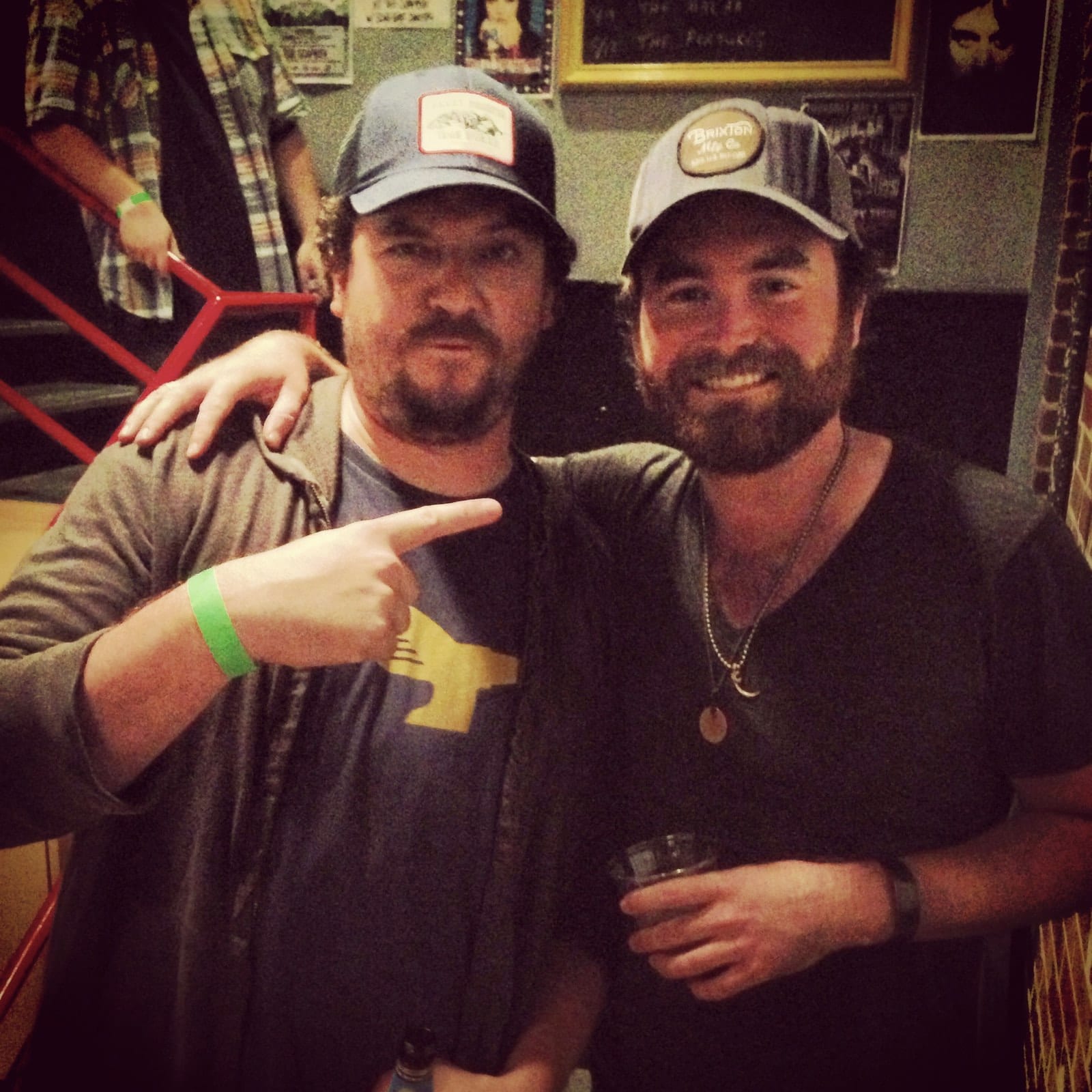 Two men posing together backstage during the Wilmington stop of the Ryan Bingham run.
